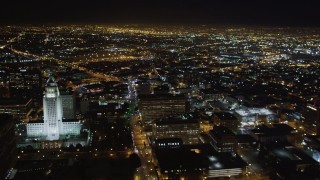 LD01_0078 - 5K aerial stock footage flyby city hall and skyscrapers at night in Downtown Los Angeles, California