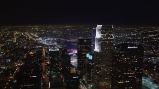 LD01_0079 - 5K aerial stock footage of panning across skyscrapers in night inDowntown Los Angeles, California