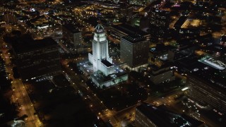 LD01_0086 - 5K stock footage aerial video flyby skyscrapers at night in Downtown Los Angeles, California toward city hall