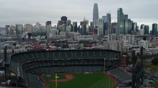 PP0002_000001 - 5.7K stock footage aerial video of ascending near AT&T Park baseball stadium and pan to city skyline, Downtown San Francisco, California