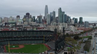 PP0002_000020 - 5.7K stock footage aerial video descend near AT&T Park and tilt to reveal city skyline in background, Downtown San Francisco, California