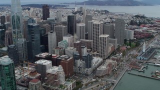 PP0002_000041 - 5.7K stock footage aerial video tilt from skyscrapers in Downtown San Francisco, California to reveal Embarcadero and Bay Bridge
