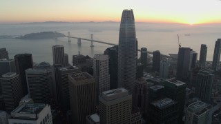 PP0002_000055 - 5.7K stock footage aerial video reverse view of Salesforce Tower and skyscrapers at sunrise in Downtown San Francisco, California