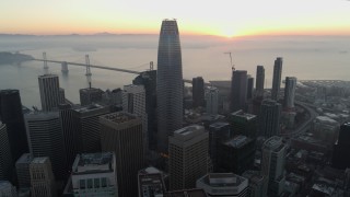 PP0002_000056 - 5.7K stock footage aerial video fly away from Salesforce Tower and skyscrapers at sunrise in Downtown San Francisco, California