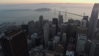 PP0002_000060 - 5.7K stock footage aerial video pan from Transamerica Pyramid to reveal Salesforce Tower at sunrise in Downtown San Francisco, California