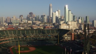 PP0002_000083 - 5.7K stock footage aerial video ascend from baseball stadium to focus on the skyline of Downtown San Francisco, California
