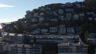 PP0002_000131 - 5.7K stock footage aerial video ascend by waterfront condos to a view hillside homes in Sausalito, California