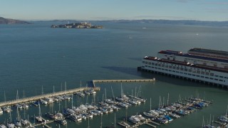 PP0002_000147 - 5.7K stock footage aerial video pan from Fort Mason piers to reveal Alcatraz, San Francisco, California