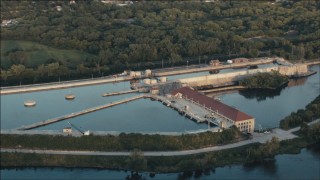 PP001_005 - HD aerial stock footage of the Lockport Powerhouse at sunset in Joliet, Illinois