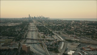 PP001_018 - HD aerial stock footage of the city skyline seen from the interstate at sunset, Downtown Chicago, Illinois