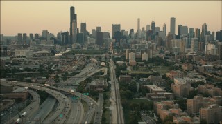 PP001_024 - HD aerial stock footage of tilting from train tracks to reveal the skyline at sunset, Downtown Chicago, Illinois
