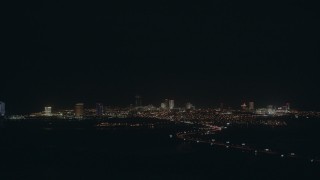 PP003_003 - HD stock footage aerial video approach the city skyline with hotels and casinos in Atlantic City, New Jersey at night
