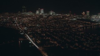 PP003_008 - HD stock footage aerial video tilt from busy street to reveal hotels and casinos at night, Atlantic City, New Jersey