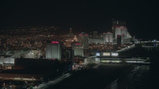 PP003_019 - HD stock footage aerial video of beachfront hotels and casinos at night in Atlantic City, New Jersey