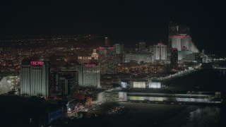 PP003_020 - HD stock footage aerial video of several beachside hotels and casinos at night in Atlantic City, New Jersey