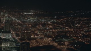 PP003_026 - HD stock footage aerial video of flying by city apartment buildings at night in Atlantic City, New Jersey