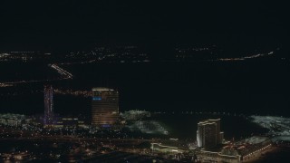 PP003_027 - HD stock footage aerial video pan across hotels, casinos, and city sprawl at night in Atlantic City, New Jersey