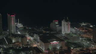 PP003_029 - HD stock footage aerial video approach Trump Taj Mahal Hotel and Casino at night in Atlantic City, New Jersey