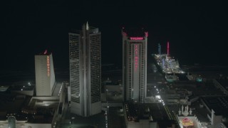 PP003_030 - HD stock footage aerial video of panning across hotels and casinos at night in Atlantic City, New Jersey
