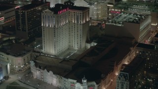 PP003_032 - HD stock footage aerial video of tilting from the boardwalk to hotels and casinos at night in Atlantic City, New Jersey