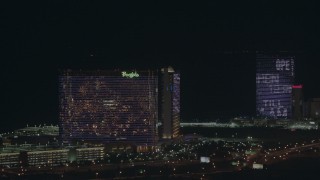 PP003_033 - HD stock footage aerial video pan across hotels and casinos at night, Atlantic City, New Jersey