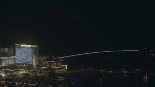 PP003_034 - HD stock footage aerial video of panning from Golden Nugget hotel and casino to a bridge at night, Atlantic City, New Jersey