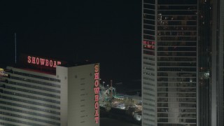 PP003_037 - HD stock footage aerial video of Steel Pier behind a hotel and casino at night in Atlantic City, New Jersey