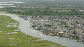 PP003_039 - HD stock footage aerial video of approaching riverfront homes in Seaford, New York