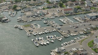 PP003_040 - HD stock footage aerial video fly over riverfront homes and a marina in Seaford, New York