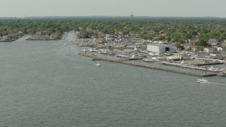 PP003_044 - HD stock footage aerial video of tilting from fishing boat in the bay to marina in Merrick, New York