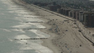 PP003_055 - HD stock footage aerial video of beach-goers near the boardwalk in Long Beach, New York