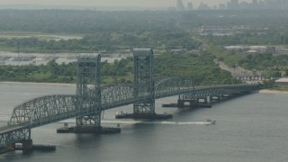 PP003_057 - HD stock footage aerial video of tilting from a bridge to reveal the Lower Manhattan skyline, Breezy Point, New York