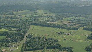 PP003_058 - HD stock footage aerial video of a rural landscape of farms and fields in Jackson, New Jersey
