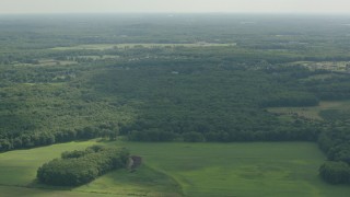 PP003_061 - HD stock footage aerial video of approaching forest and rural neighborhoods in Jackson, New Jersey