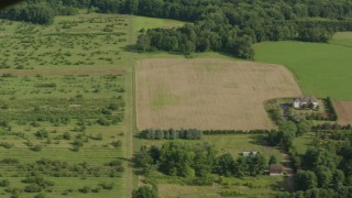 PP003_077 - HD stock footage aerial video flyby farm fields to reveal a farmhouse in Jackson, New Jersey
