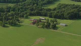 PP003_079 - HD stock footage aerial video flyby barns and green fields at a farm in Jackson, New Jersey