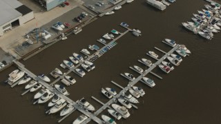 PP003_086 - HD stock footage aerial video of a bird's eye view of boats at a small river marina in Delran, New Jersey