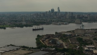 PP003_087 - HD stock footage aerial video skyscrapers of the city skyline seen from across the river, Downtown Philadelphia, Pennsylvania