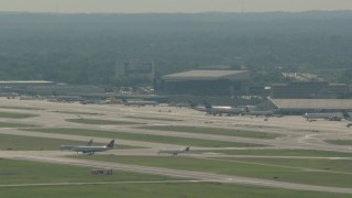 PP003_097 - HD stock footage aerial video of commercial planes on the runways at Philadelphia International Airport, Pennsylvania