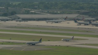 PP003_098 - HD stock footage aerial video of a commercial jet taxiing on the runway at Philadelphia International Airport, Pennsylvania