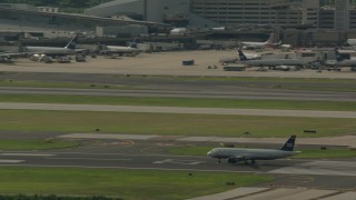 PP003_099 - HD stock footage aerial video of a commercial airplane on the runway at Philadelphia International Airport, Pennsylvania