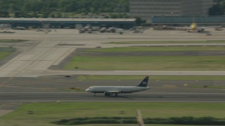 PP003_100 - HD stock footage aerial video track a commercial airplane taking off from Philadelphia International Airport, Pennsylvania