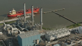 PP003_105 - HD stock footage aerial video of riverfront buildings at an oil refinery in Chester, Pennsylvania