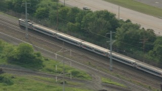PP003_109 - HD stock footage aerial video of tracking a passenger train in Wilmington, Delaware