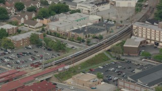 PP003_115 - HD stock footage aerial video of a commuter train arriving at a station in Wilmington, Delaware