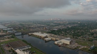 PVED01_002 - 4K aerial stock footage of Industrial Canal in Upper Ninth Ward at sunrise, New Orleans, Louisiana