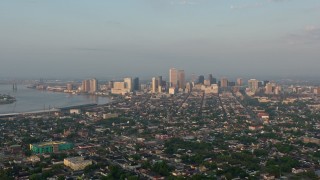 PVED01_004 - 4K aerial stock footage approach the French Quarter and Downtown New Orleans, Louisiana sunrise