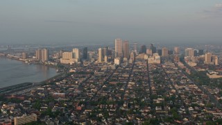 PVED01_005 - 4K aerial stock footage of fly over French Quarter to approach Downtown at sunrise, New Orleans, Louisiana