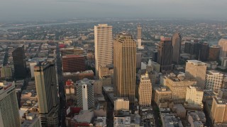 PVED01_007 - 4K aerial stock footage tilt from French Quarter to approach Downtown New Orleans, Louisiana at sunrise