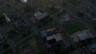 PVED01_009E - 4K aerial stock footage fly over Downtown New Orleans toward the Mississippi River at sunrise, Louisiana